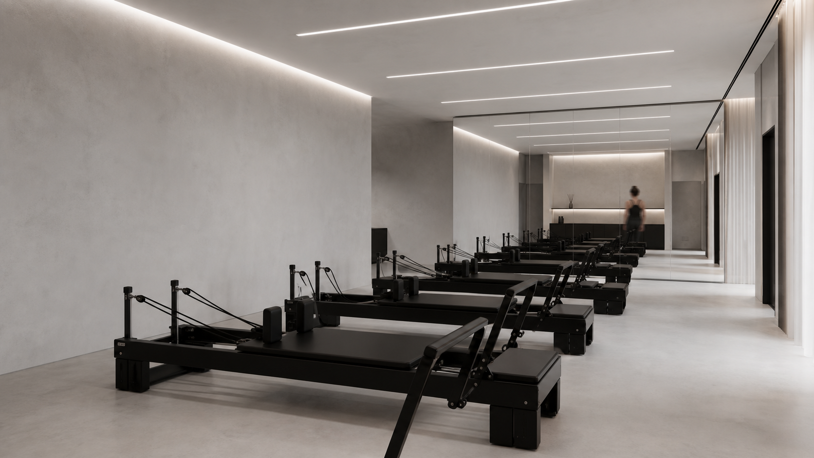 主教室內的黑色 Reformer 器械與線性燈光